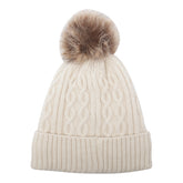 BERRETTO CON POMPON